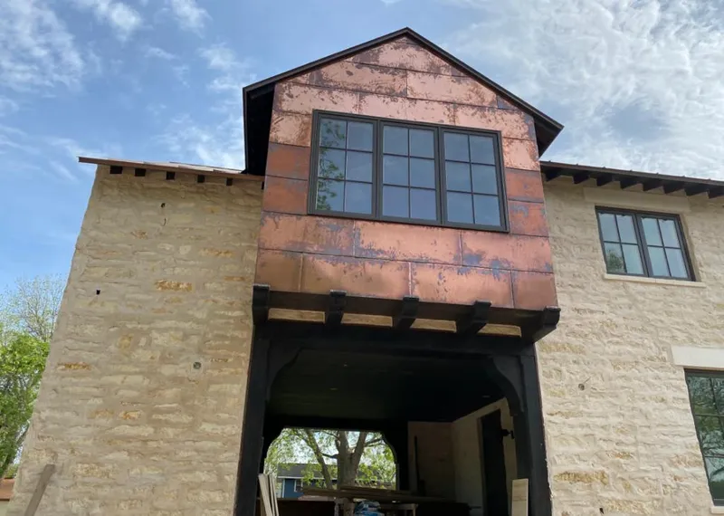 Copper metal panel facade on a stone building for Roof Repair in Strongsville